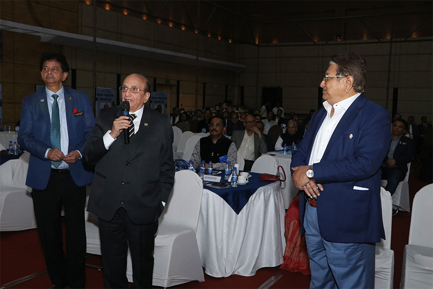 Premium conference setup with rows of chairs and branded podium, Kochi